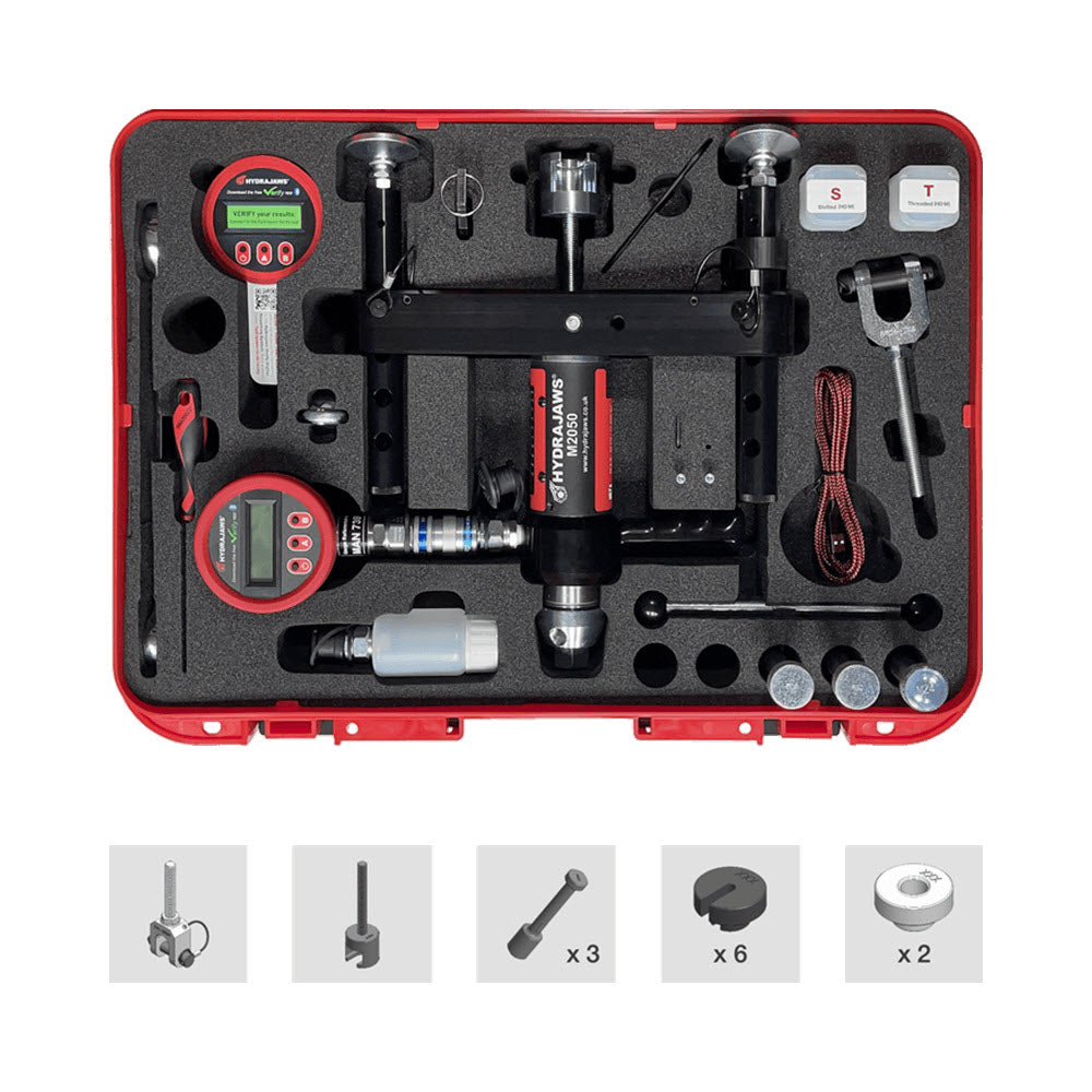 A hydrajaws M2050 tool kit in a red hard case with foam tray, shown on a white background. The kit includes digital pressure gauges, a central hydraulic power unit, wrenches, sockets, and small accessories.