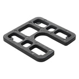 A black heavy-duty moulded load bearing shim with multiple rectangular and curved cutouts, shown on a plain white background.