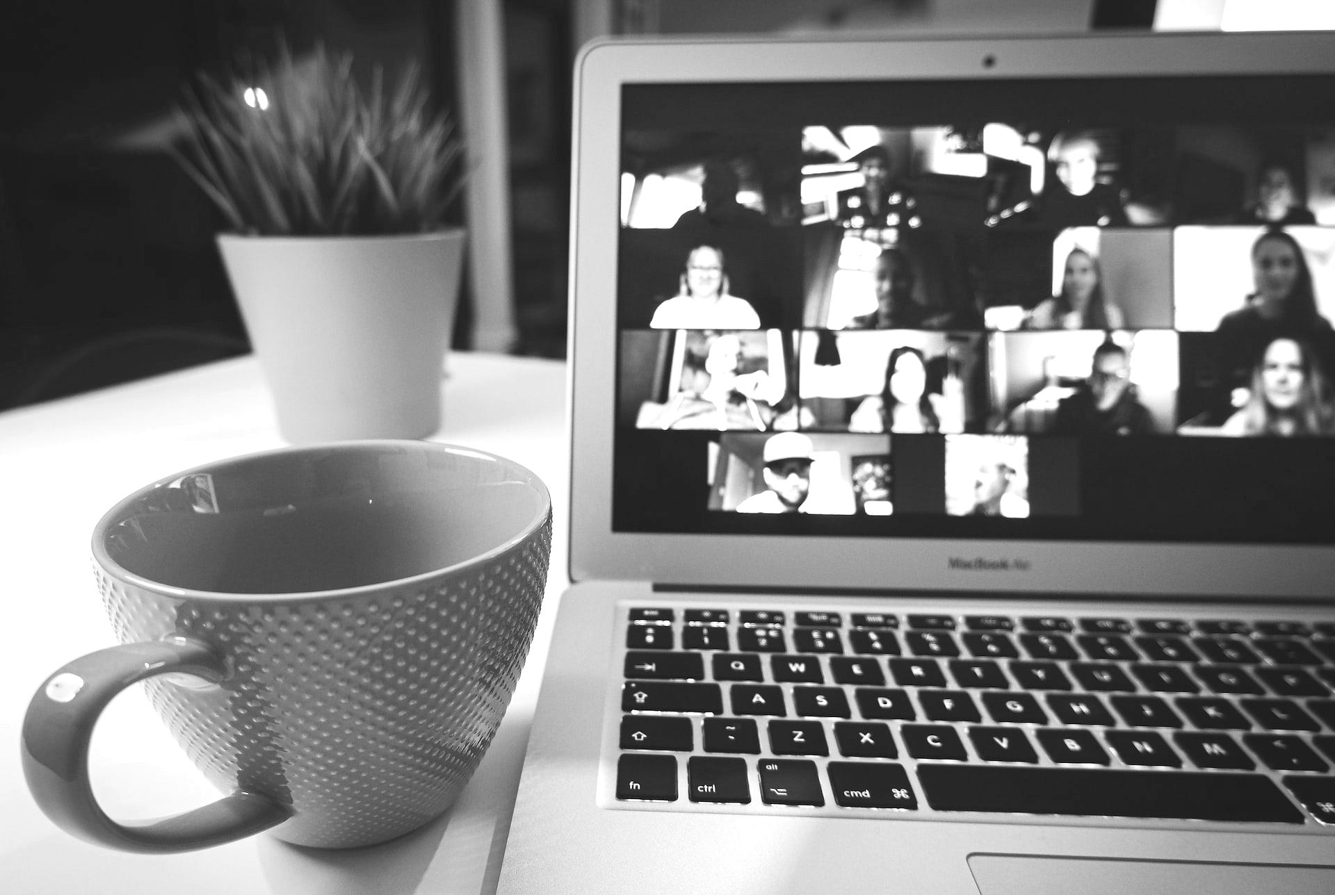 macbook air displaying woman in white shirt